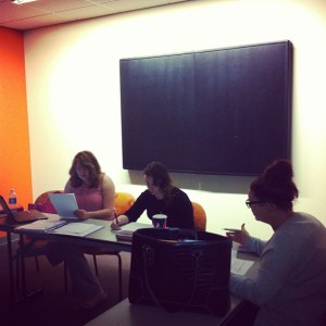 From left, Ashley, Katie and Rachel discuss how to cross-promote Frostburg content across different divisions.